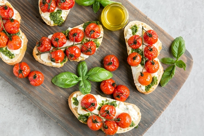 Cherry Tomato Confit Bruschetta with Ricotta & Basil Pesto - The Petite ...