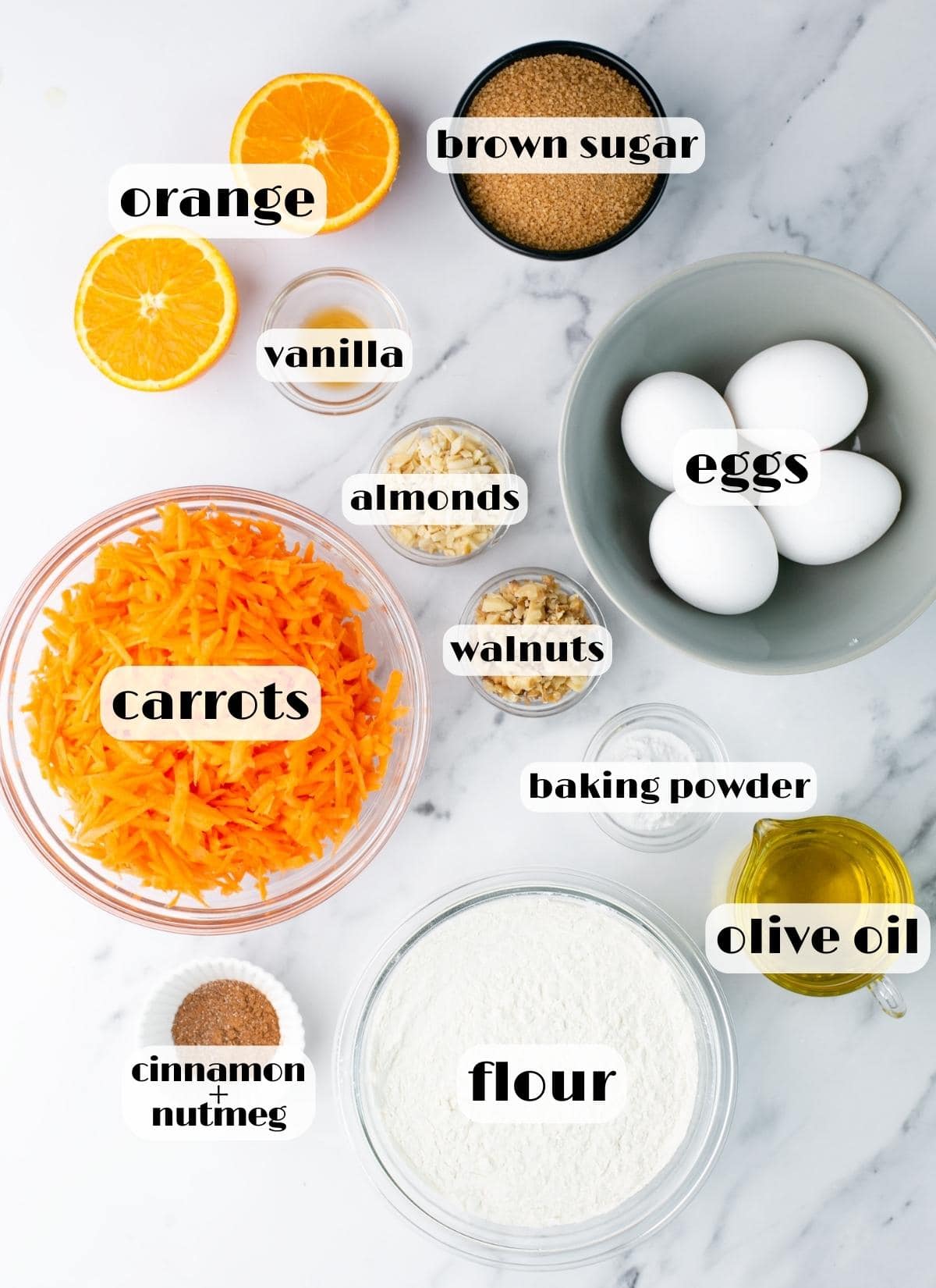 carrot cake ingredients: sugar, orange, eggs, almonds, walnuts, oil, flour, baking powder, carrots, vanilla.