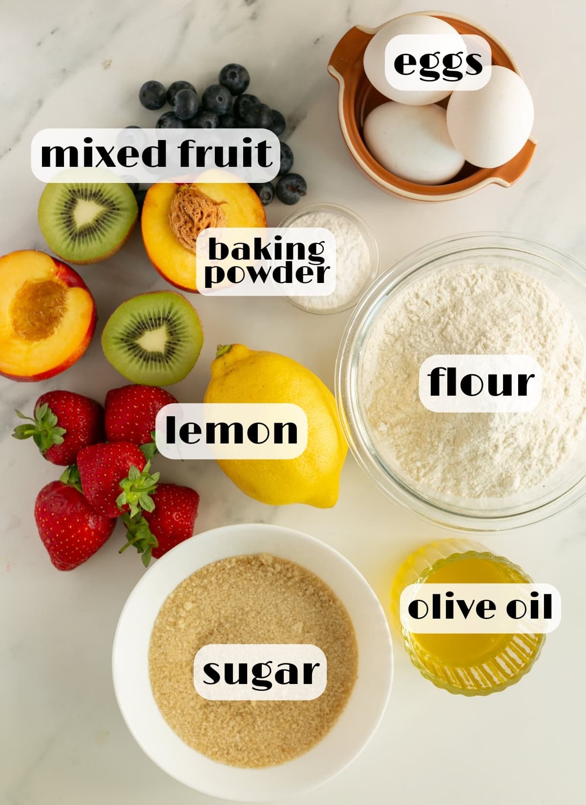 italian fruit cake ingredients: mixed fruit, flour, sugar, eggs, lemon, baking powder, olive oil.