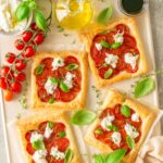 Caprese puff pastry with tomatoes, basil and burrata cheese.