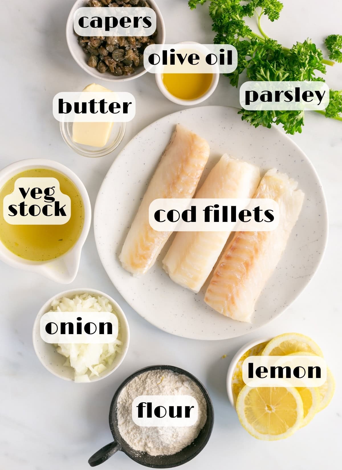 cod piccata ingredients: cod fillets, lemon, flour, butter, capers, onion, parsley, vegetable stock, olive oil.