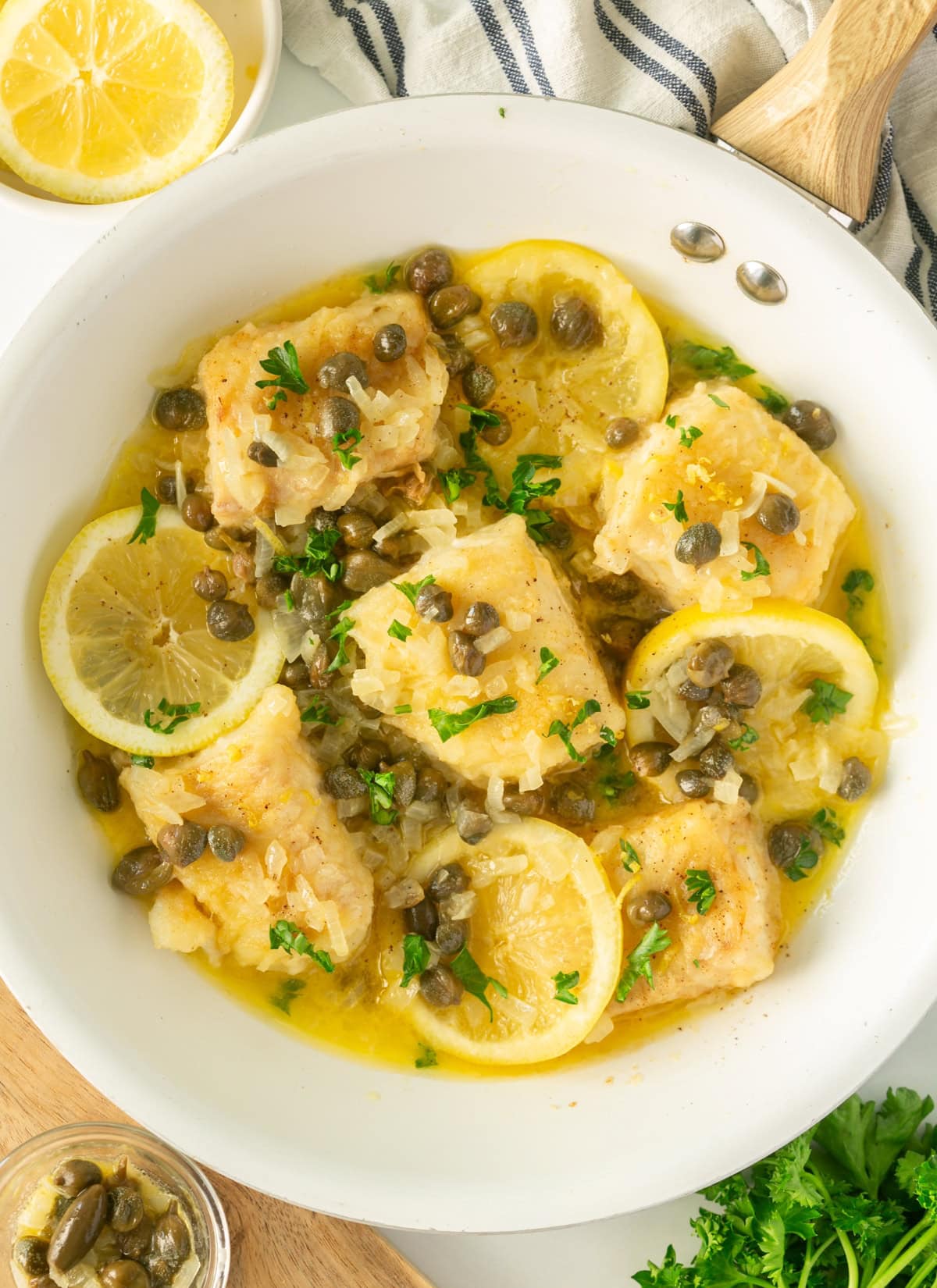 cod piccata served with a lemon and capers sauce.