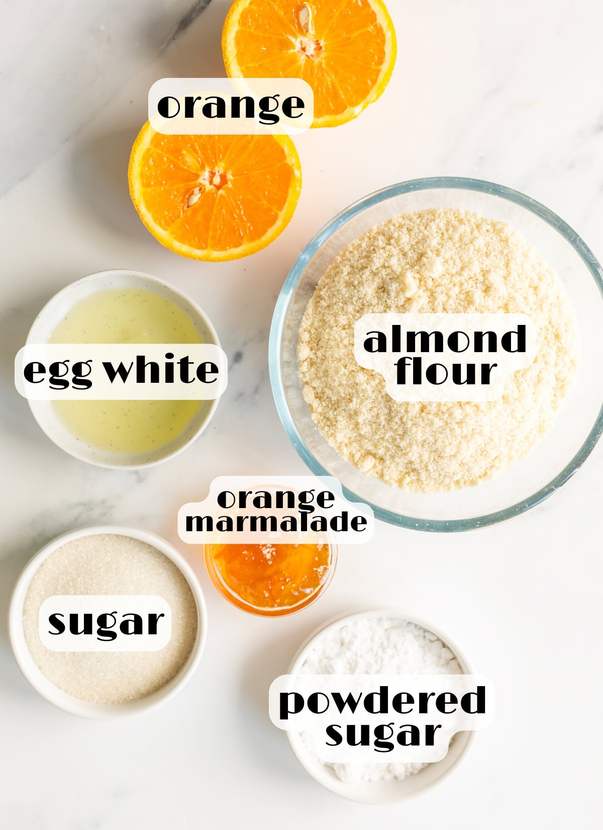 orange cookie ingredients: almond flour, egg white, orange, sugar, orange marmalade, powdered sugar.