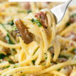 sausage mushroom pasta. Image with text for Pinterest.