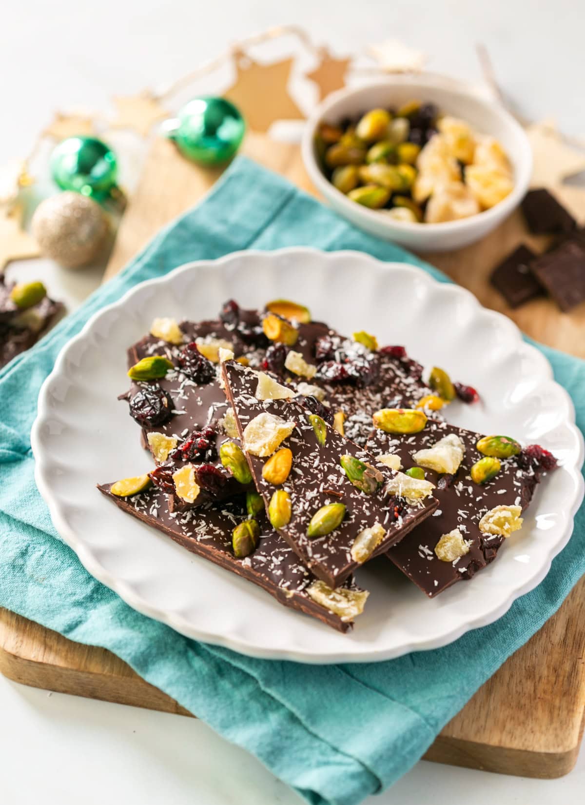 christmas bark with pistachios, cranberries, coconut, candied ginger.