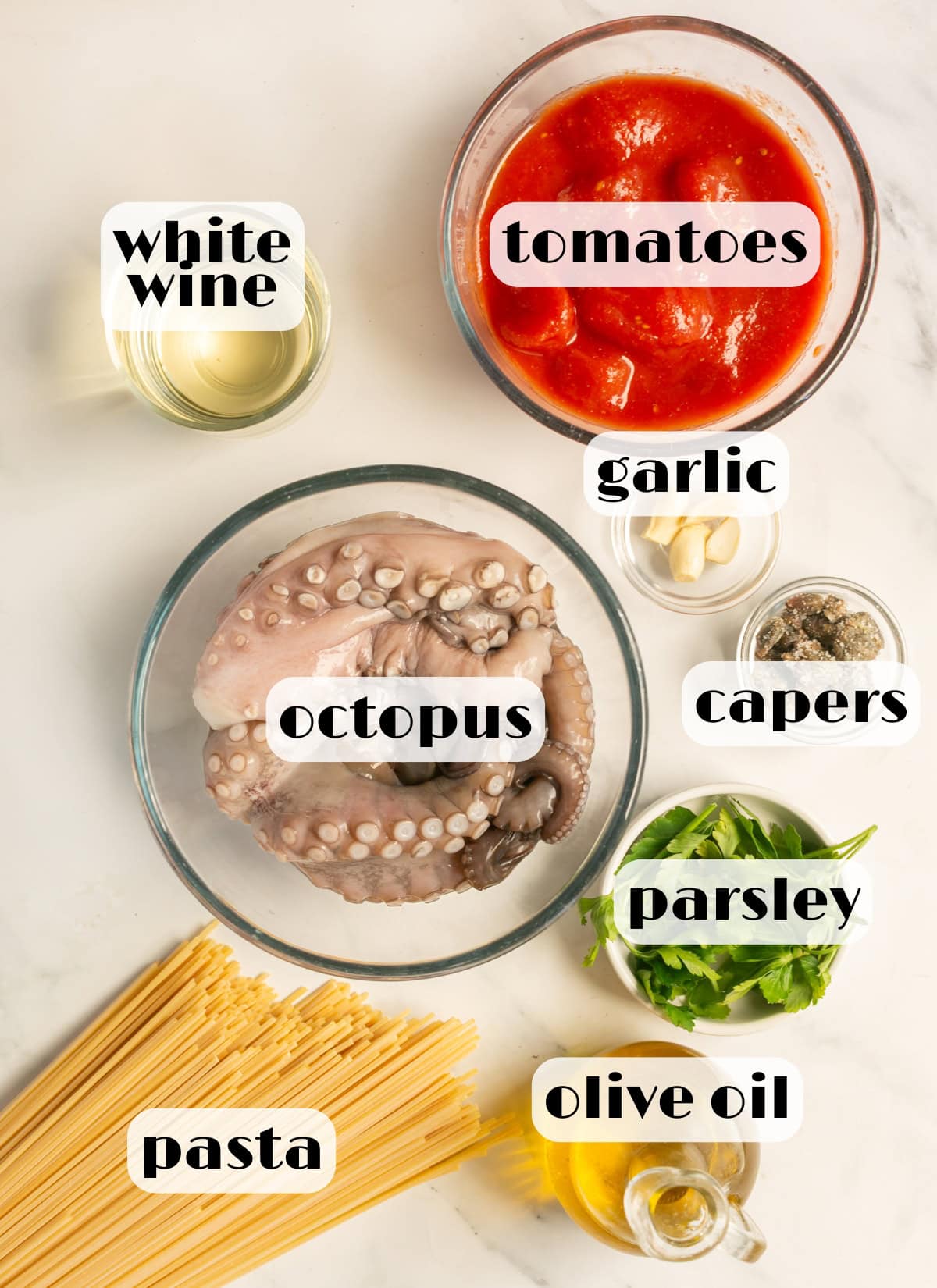 octopus pasta ingredients: pasta, cleaned octopus, canned tomatoes, parsley, capers, olive oil, garlic, white wine.